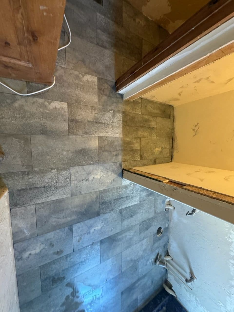 Project Crafting a Stunning Custom Shower with Stone and Pebble Accents image